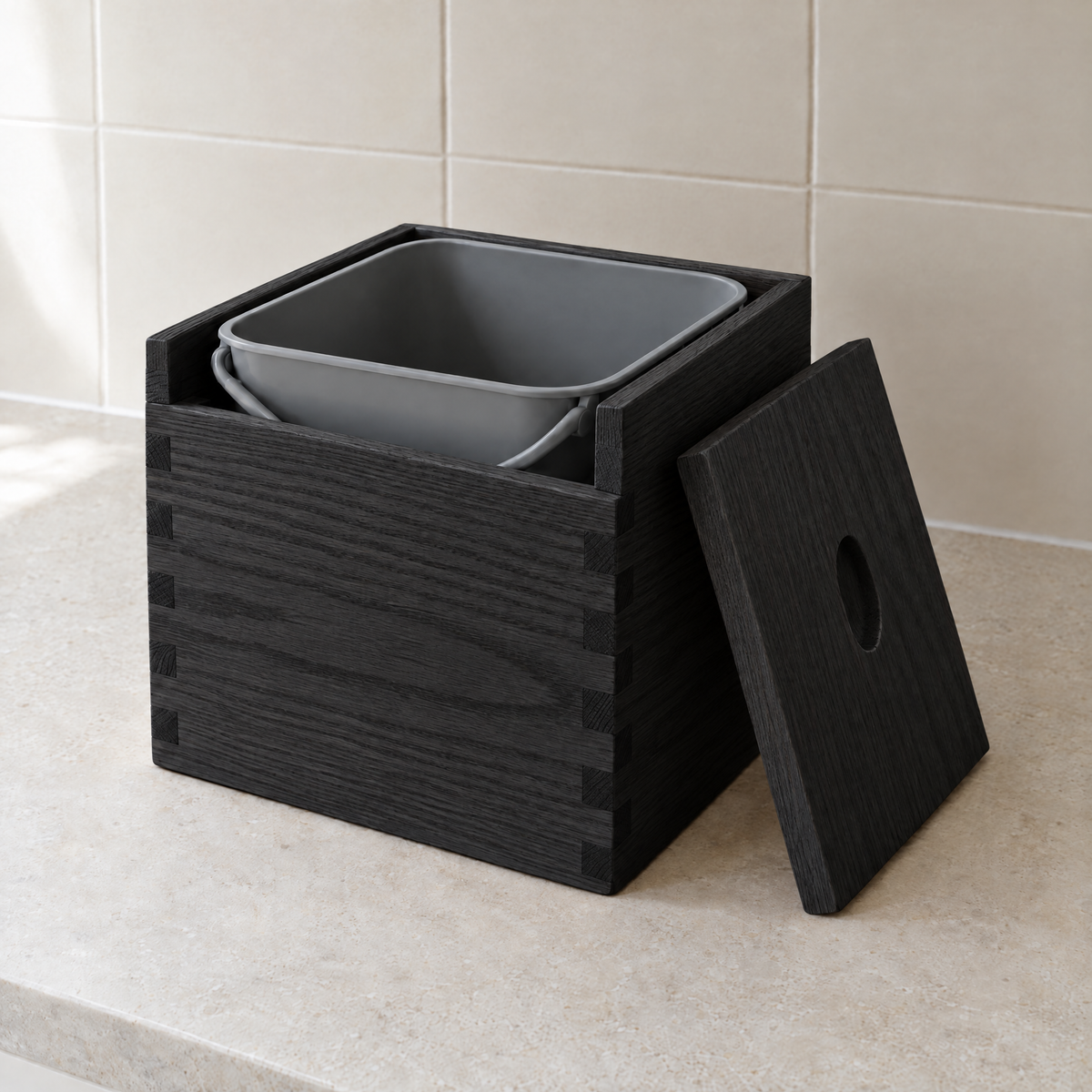 Countertop compost box in black-stained ash with its lid off